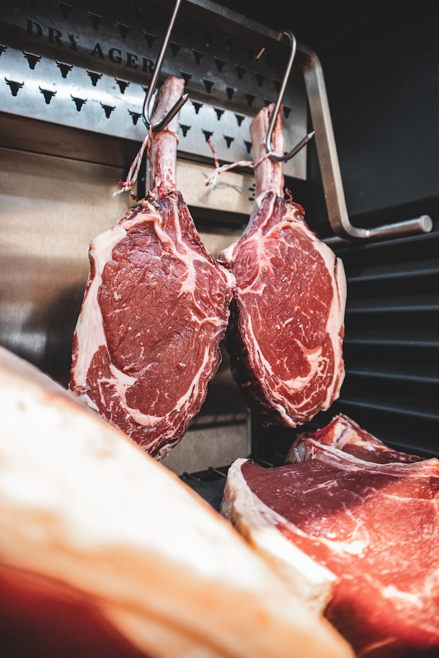 A beef tomahawk at a butcher shop to represent the meat works industry